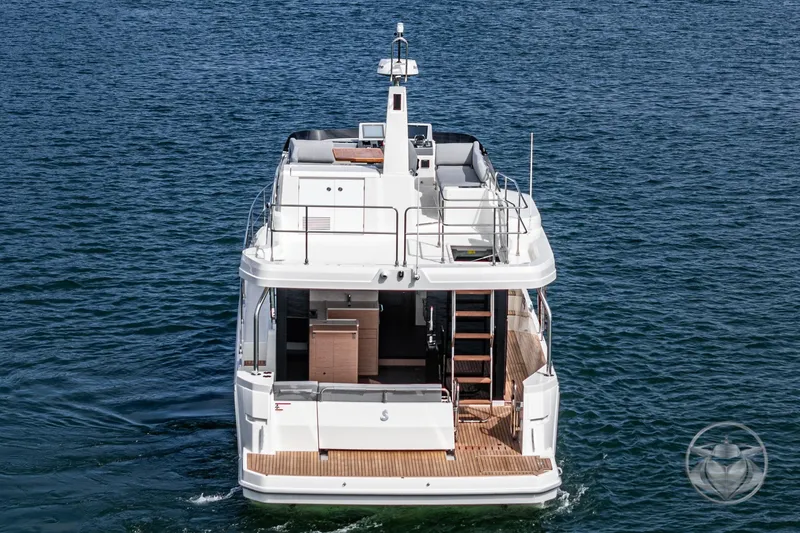 Slide: The Image of 2026 Beneteau Swift Trawler 41 Fly on open water, rear view. - 35