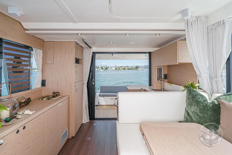Slide: The Image of Interior of 2026 Beneteau Swift Trawler 41 Fly, featuring modern design and waterfront view. - 42