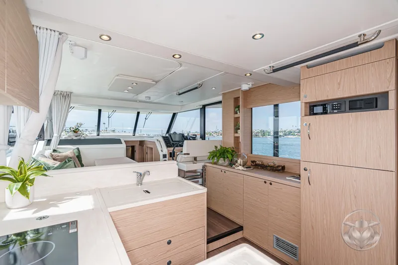 Slide: The Image of Luxurious interior of 2026 Beneteau Swift Trawler 41 Fly with modern kitchen and scenic views. - 48
