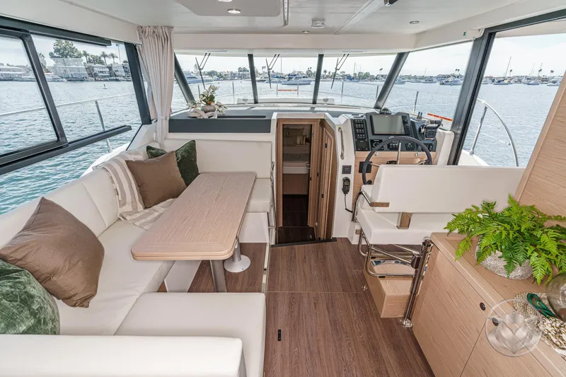 Slide: The Image of Luxurious interior of 2026 Beneteau Swift Trawler 41 Fly with elegant seating and helm. - 51