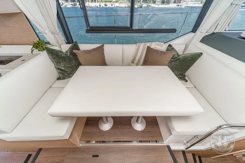 Slide: The Image of Luxurious interior of 2026 Beneteau Swift Trawler 41 Fly with elegant seating and table. - 55