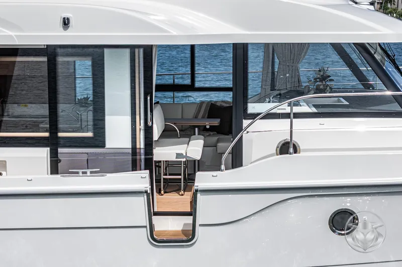 Slide: The Image of 2026 Beneteau Swift Trawler 41 Fly, elegant interior view with ocean backdrop. - 59