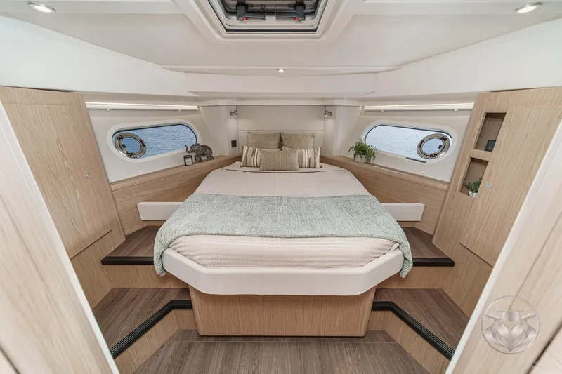 Slide: The Image of Luxurious cabin interior of 2026 Beneteau Swift Trawler 41 Fly with elegant wood finish. - 62