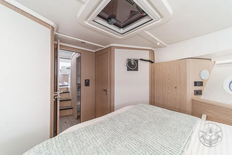 Slide: The Image of Interior cabin of 2026 Beneteau Swift Trawler 41 Fly, featuring modern wood finishes. - 63