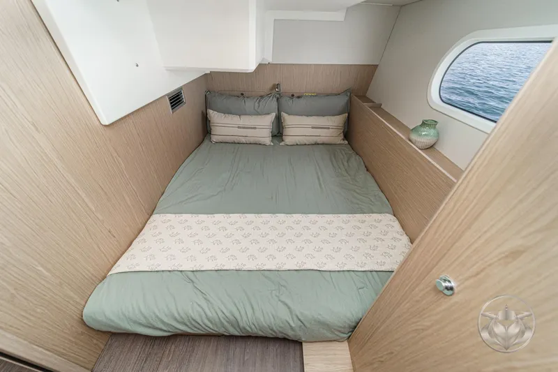 Slide: The Image of 2026 Beneteau Swift Trawler 41 Fly cabin with cozy bed and ocean view. - 66