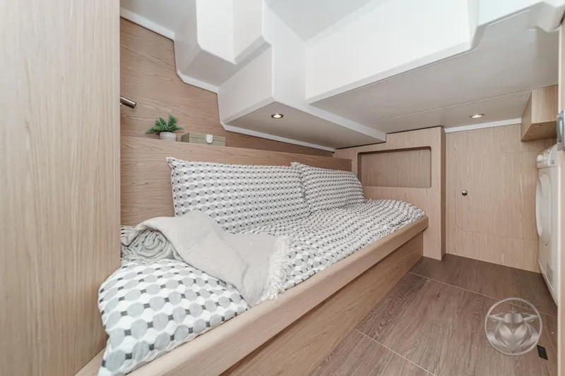 Slide: The Image of 2026 Beneteau Swift Trawler 41 Fly cabin interior with cozy bedding and modern design. - 67
