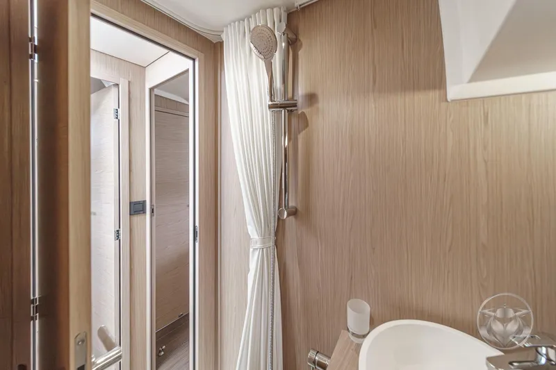 Slide: The Image of Bathroom interior of 2026 Beneteau Swift Trawler 41 Fly, featuring modern shower and sink. - 71