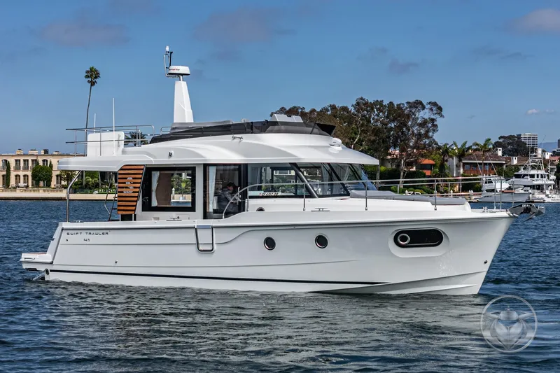 Slide: The Image of 2026 Beneteau Swift Trawler 41 Fly cruising on a calm waterway. - 9
