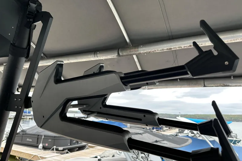 Slide: The Image of Modern Axis A245 boat accessory, 2025 model, mounted under a canopy at a marina. - 10
