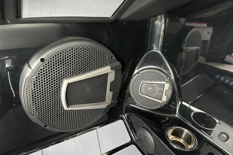 Slide: The Image of 2025 Axis A245 boat interior with sleek speaker system and modern design elements. - 12