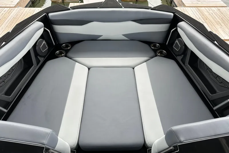 Slide: The Image of Luxurious interior of 2025 Axis A245 boat with spacious seating and cup holders. - 2