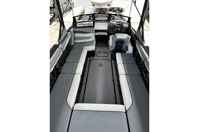 Slide: The Image of 2025 Axis A245 boat interior with spacious seating and modern dashboard design. - 4