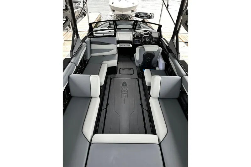 Slide: The Image of Interior of 2025 Axis A245 boat with sleek seating and modern dashboard design. - 5