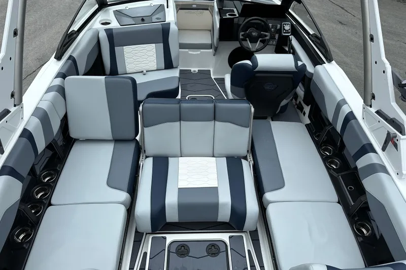 Slide: The Image of 2025 Malibu Wakesetter 22 MXZ interior with stylish seating and modern dashboard design. - 13