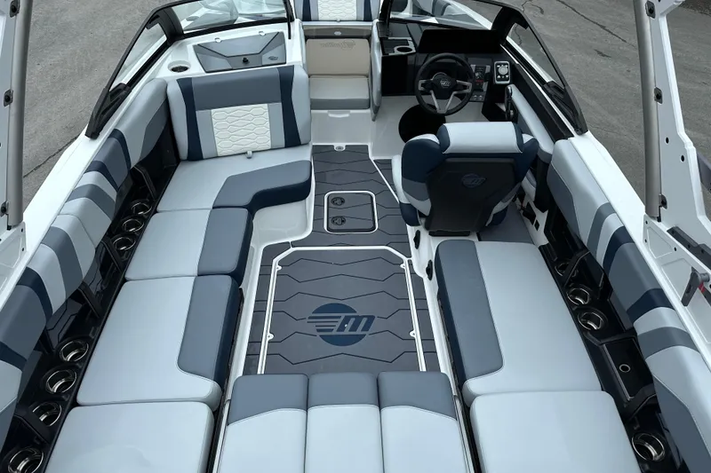Slide: The Image of 2025 Malibu Wakesetter 22 MXZ interior with sleek seating and modern design. - 6