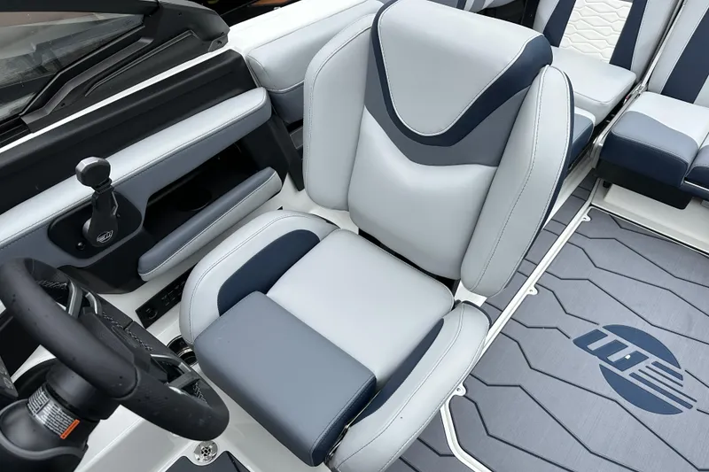 Slide: The Image of 2025 Malibu Wakesetter 22 MXZ interior with sleek, modern seating and steering wheel design. - 9