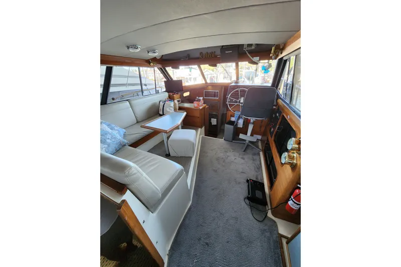 Slide: The Image of Interior of 1992 Bayliner 3288 Motoryacht with seating, helm, and navigation equipment. - 13