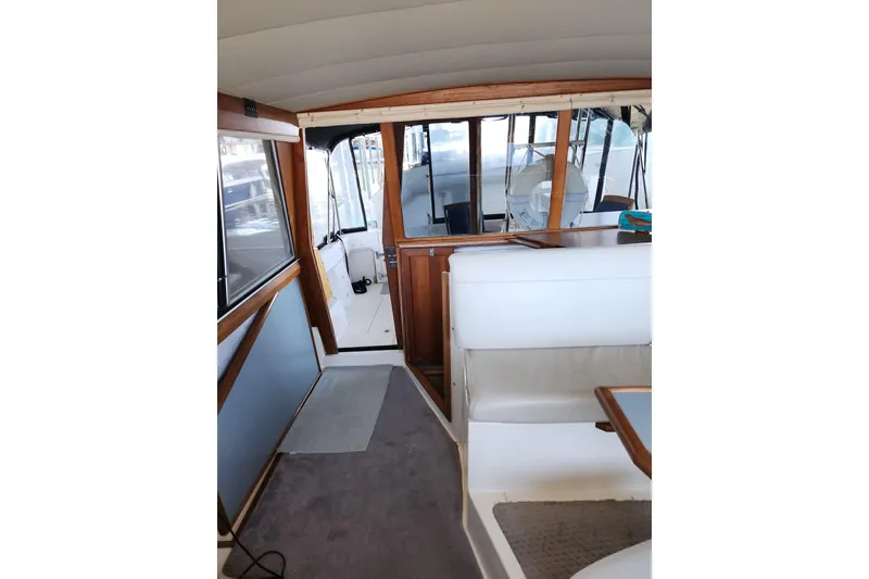 Slide: The Image of Interior of 1992 Bayliner 3288 Motoryacht with seating and wooden accents. - 15