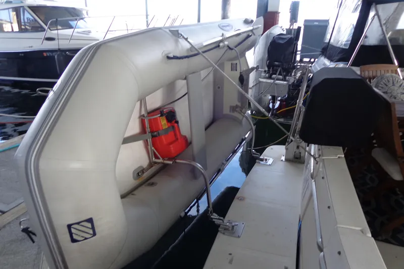 Slide: The Image of 1992 Bayliner 3288 Motoryacht with inflatable dinghy docked at marina. - 18