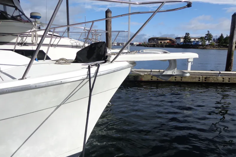 Slide: The Image of 1992 Bayliner 3288 Motoryacht docked at marina, clear sky, calm water. - 8