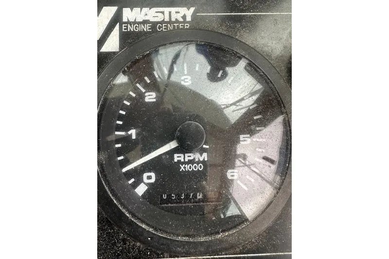 Slide: The Image of Tachometer gauge from a 1986 Cape Dory MS300, displaying RPM in thousands. - 10