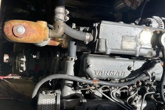 Slide: The Image of Engine of a 1986 Cape Dory MS300 boat, featuring a Yanmar diesel engine. - 11