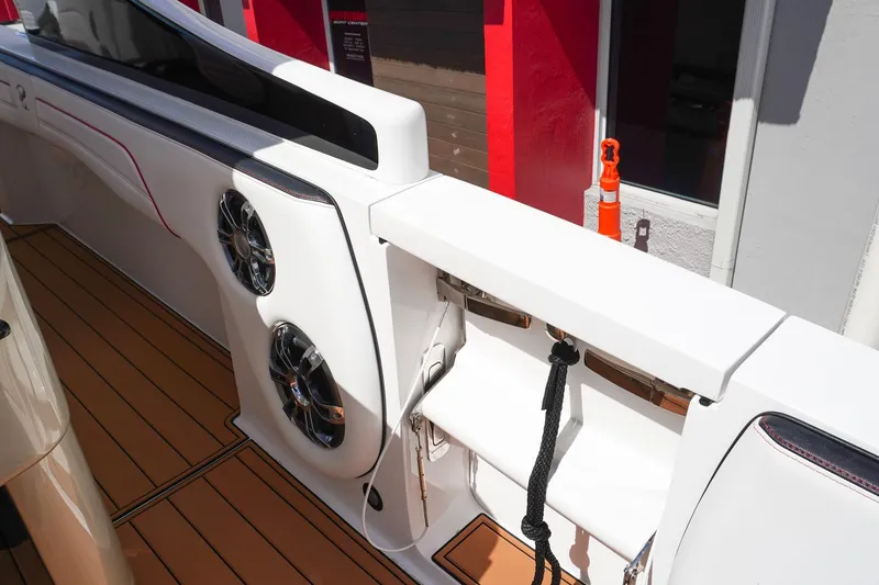 Slide: The Image of 2023 Renegade 38 GTS Open boat interior with speakers and sleek design. - 13