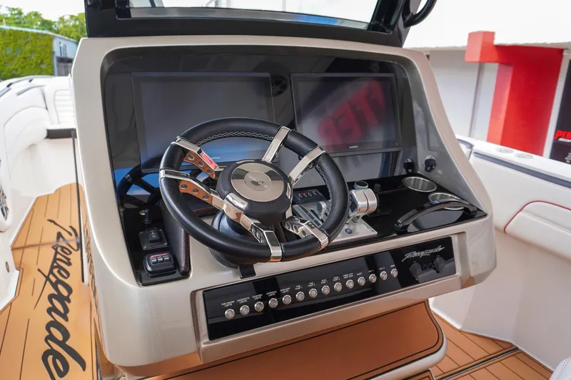 Slide: The Image of 2023 Renegade 38 GTS Open boat dashboard with steering wheel and controls. - 20