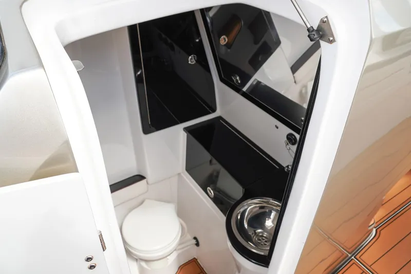 Slide: The Image of 2023 Renegade 38 GTS Open boat interior with modern bathroom amenities. - 23
