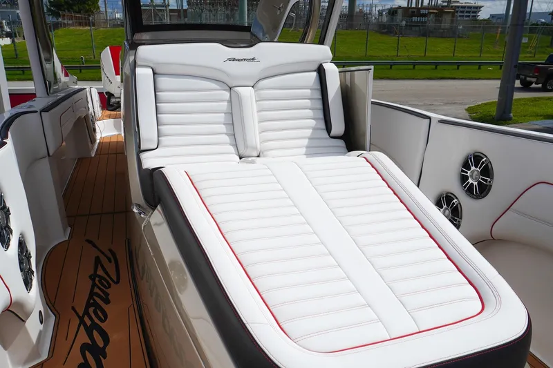 Slide: The Image of 2023 Renegade 38 GTS Open boat with luxurious white seating and sleek design. - 26