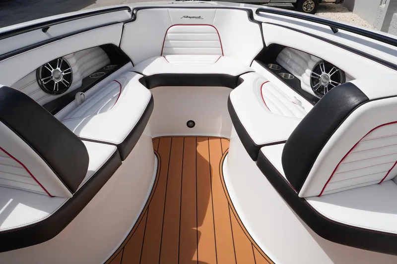 Slide: The Image of 2023 Renegade 38 GTS Open boat interior with white seating and wood flooring. - 28