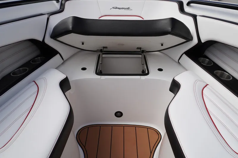 Slide: The Image of 2023 Renegade 38 GTS Open boat interior with white seating and storage compartment. - 32