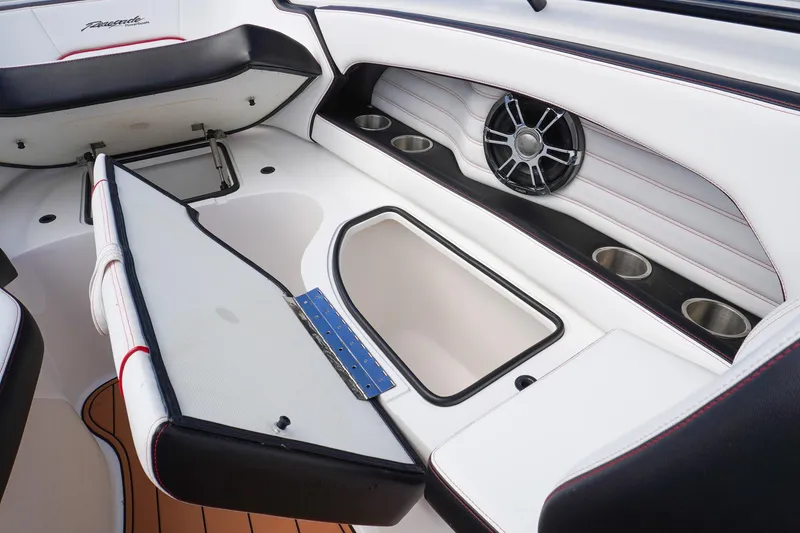 Slide: The Image of 2023 Renegade 38 GTS Open boat interior with storage, speaker, and cup holders. - 33