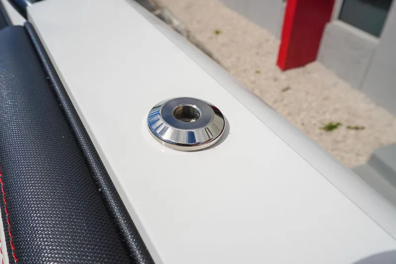 Slide: The Image of Close-up of 2023 Renegade 38 GTS Open boat detail, featuring sleek metal fitting. - 37