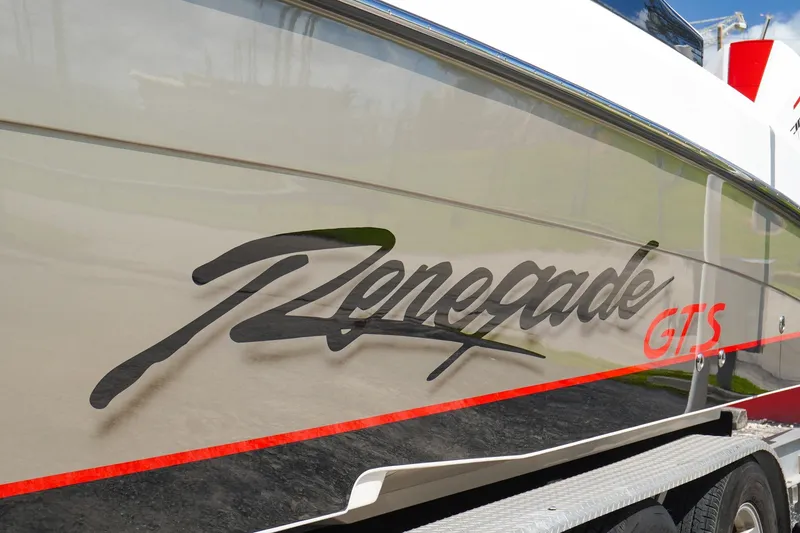 Slide: The Image of 2023 Renegade 38 GTS Open boat side view with logo and red accents. - 7
