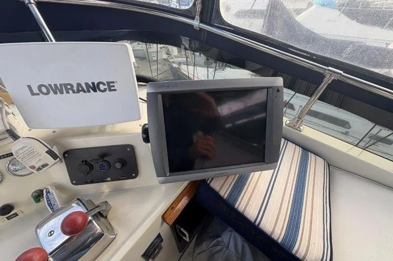 Slide: The Image of Control panel of 1987 Tollycraft 34 Sundeck Motor Yacht with Lowrance electronics. - 19