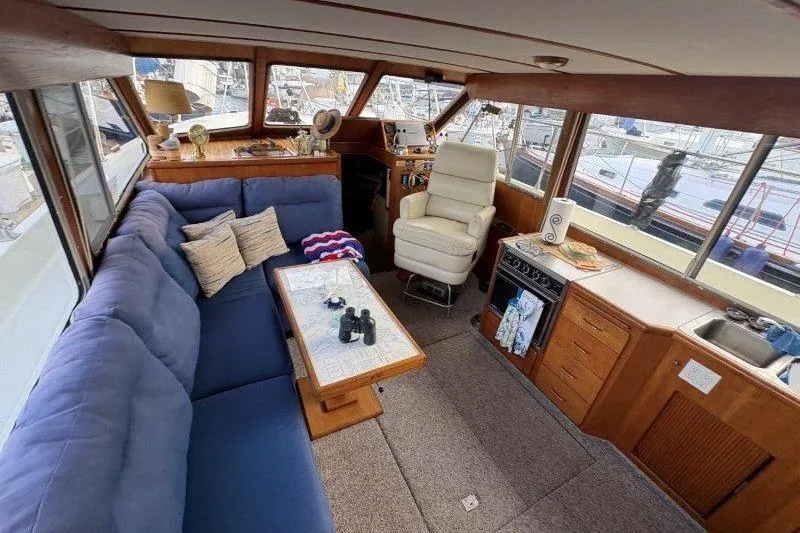 Slide: The Image of Interior of 1987 Tollycraft 34 Sundeck Motor Yacht with cozy seating and helm. - 24