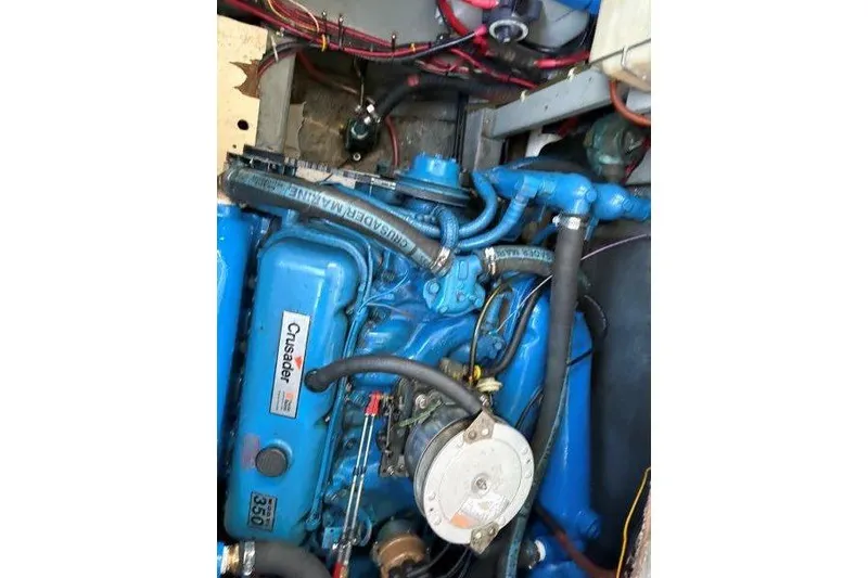 Slide: The Image of Engine of 1987 Tollycraft 34 Sundeck Motor Yacht, featuring blue Crusader components. - 50
