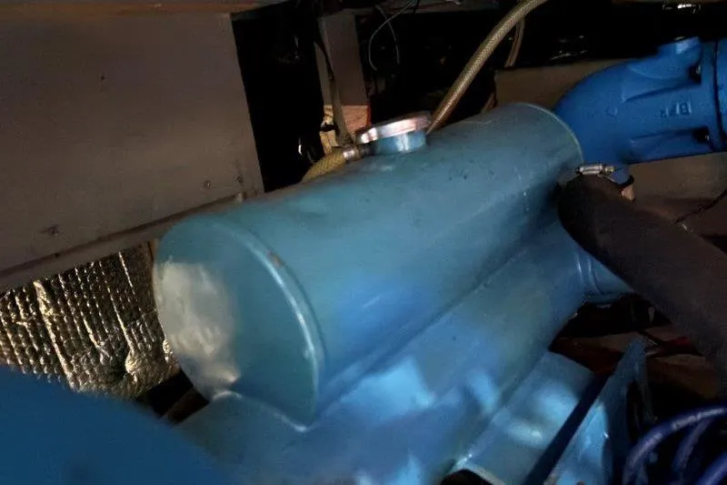 Slide: The Image of Engine compartment of 1987 Tollycraft 34 Sundeck Motor Yacht, featuring blue components. - 61