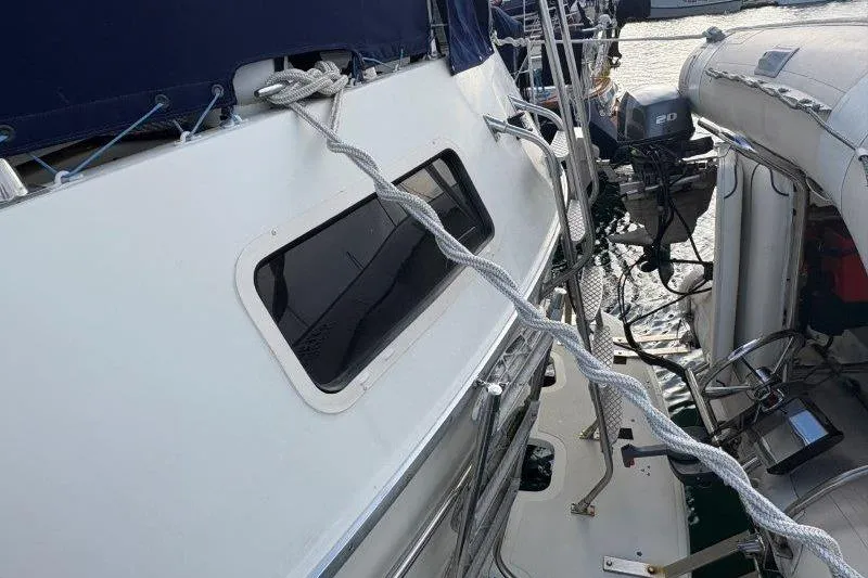 Slide: The Image of 1987 Tollycraft 34 Sundeck Motor Yacht with ropes and equipment on deck. - 9
