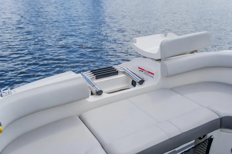 Slide: The Image of 2021 Sea Ray SDX 250 Outboard boat interior with seating and water view. - 21