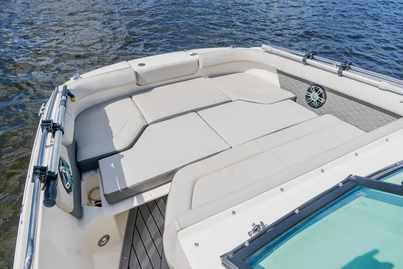 Slide: The Image of 2021 Sea Ray SDX 250 Outboard boat with spacious seating and elegant design on the water. - 24