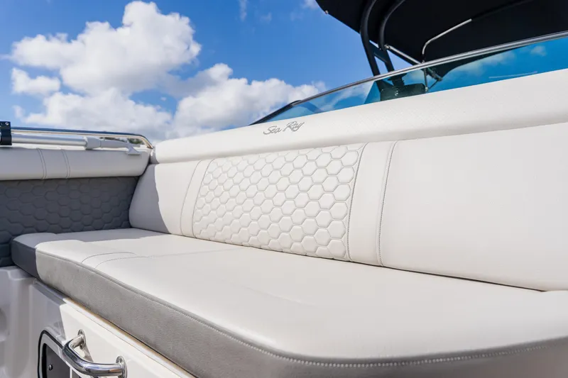 Slide: The Image of 2021 Sea Ray SDX 250 Outboard boat seating with hexagonal pattern under blue sky. - 27