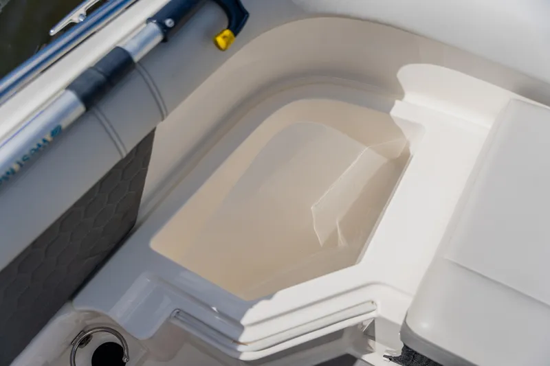 Slide: The Image of 2021 Sea Ray SDX 250 Outboard boat interior detail, featuring storage compartment. - 30
