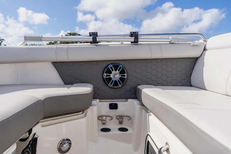 Slide: The Image of 2021 Sea Ray SDX 250 Outboard boat interior with cushioned seating and speaker. - 31