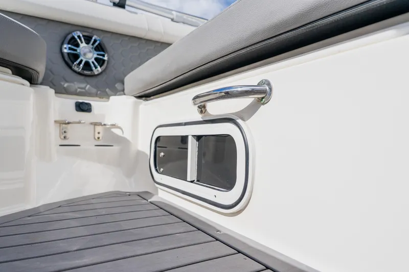 Slide: The Image of 2021 Sea Ray SDX 250 Outboard interior detail with speaker and handle. - 34
