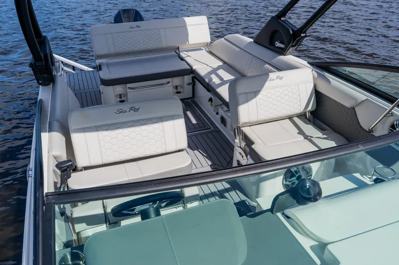 Slide: The Image of 2021 Sea Ray SDX 250 Outboard boat interior with luxurious seating on water. - 37