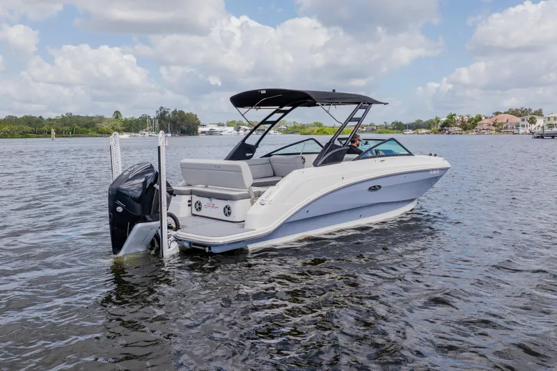 Slide: The Image of 2021 Sea Ray SDX 250 Outboard boat cruising on a scenic waterway. - 4