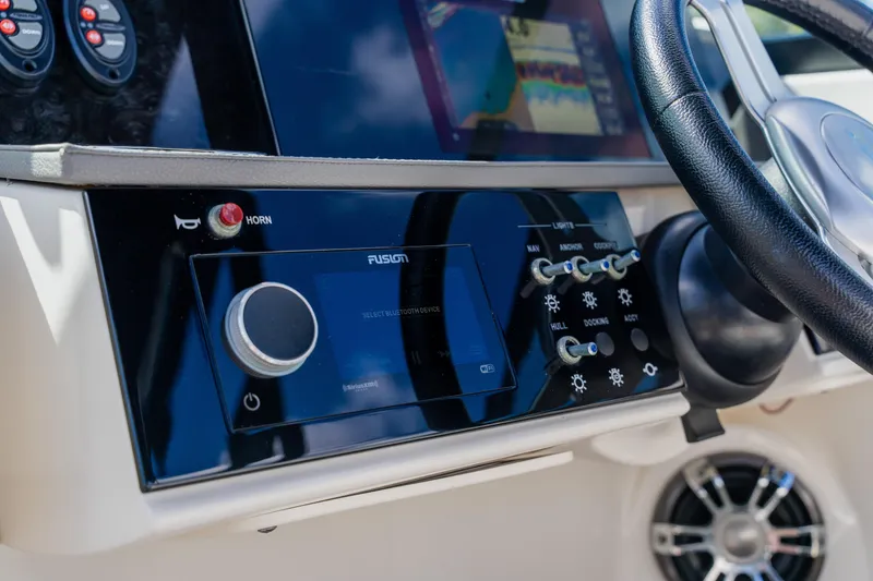Slide: The Image of Control panel of 2021 Sea Ray SDX 250 Outboard boat with steering wheel and audio system. - 43