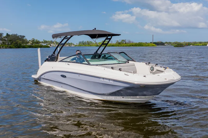 Slide: The Image of 2021 Sea Ray SDX 250 Outboard boat cruising on a sunny day. - 5